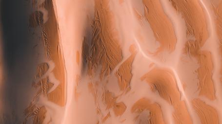 An aerial view of desert sand dunes